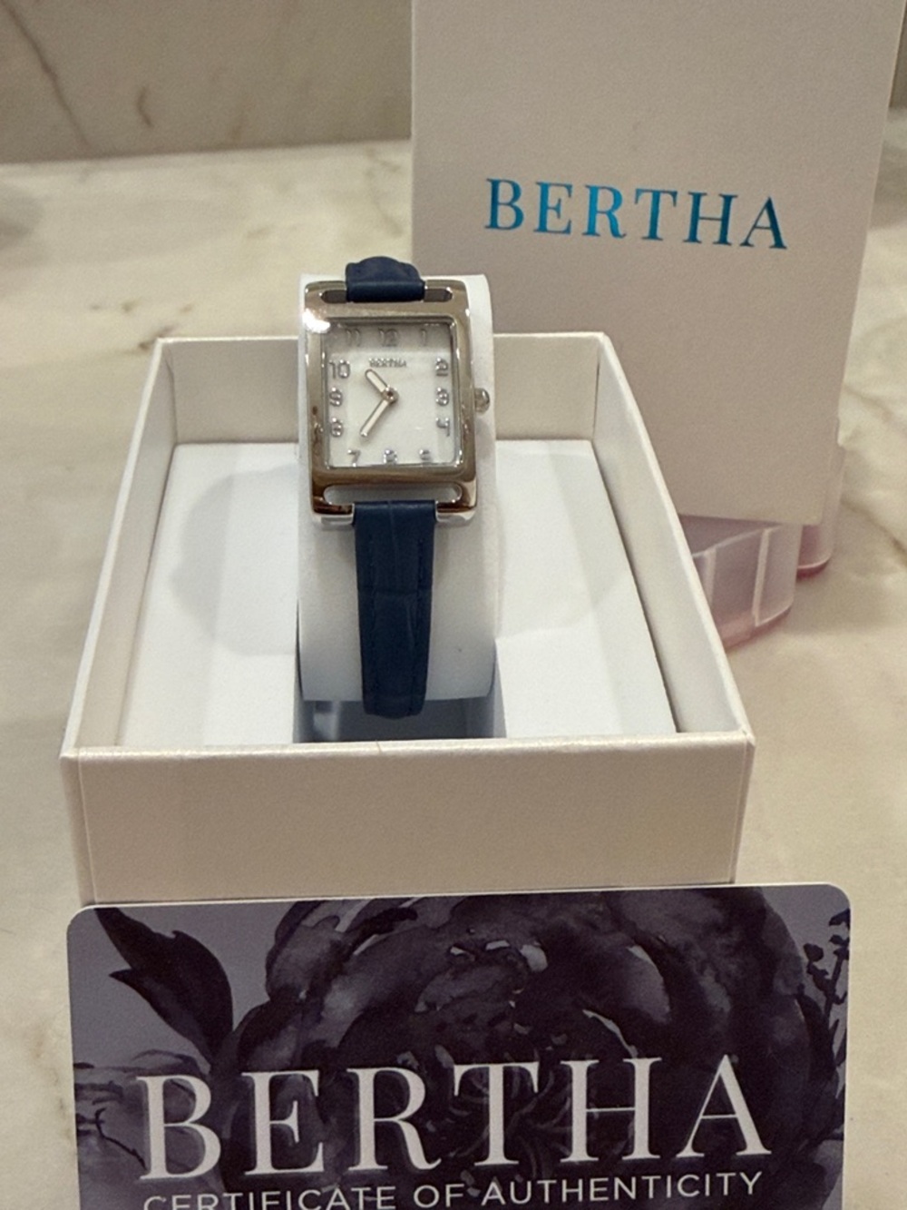 An Elegant BERTHA Watch. Blue Leather Strap Silver-Tone with a Rectangular Face